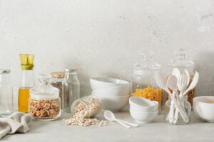 eco friendly kitchen storage. glass jars of grains , pasta nuts, transparent containers for pantry.